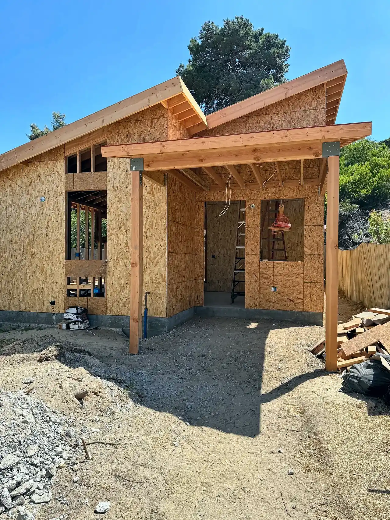 New backyard ADU we are building in Del Mar, framed and sheathed, with a butterfly roof and covered entry porch