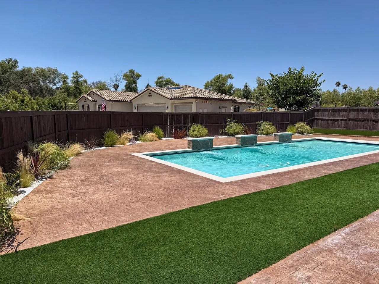 New pool, stamped concrete deck and turf in an Escondido backyard