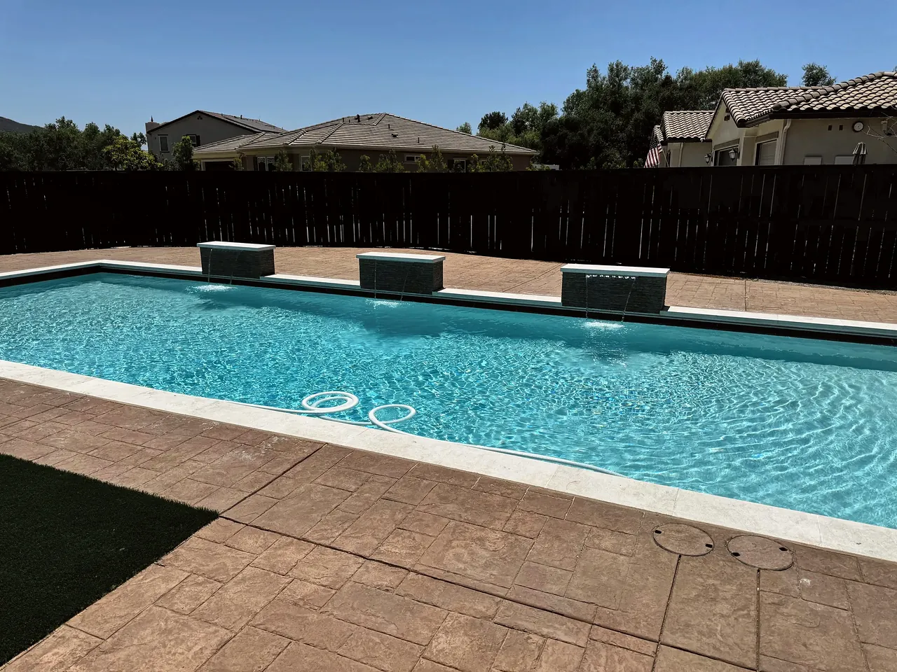 Finished pool with the water features running