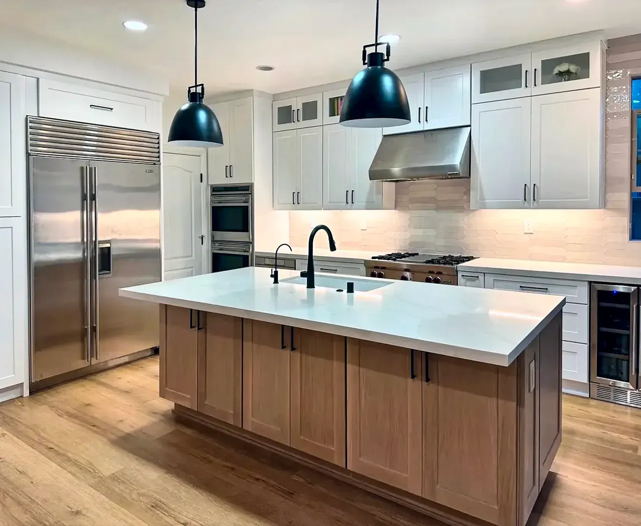 White shaker kitchen with a wood island