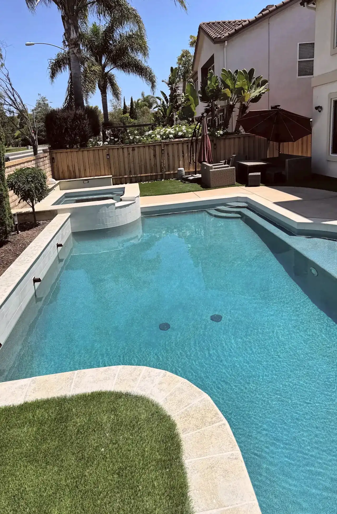 Remodeled pool with a raised spa