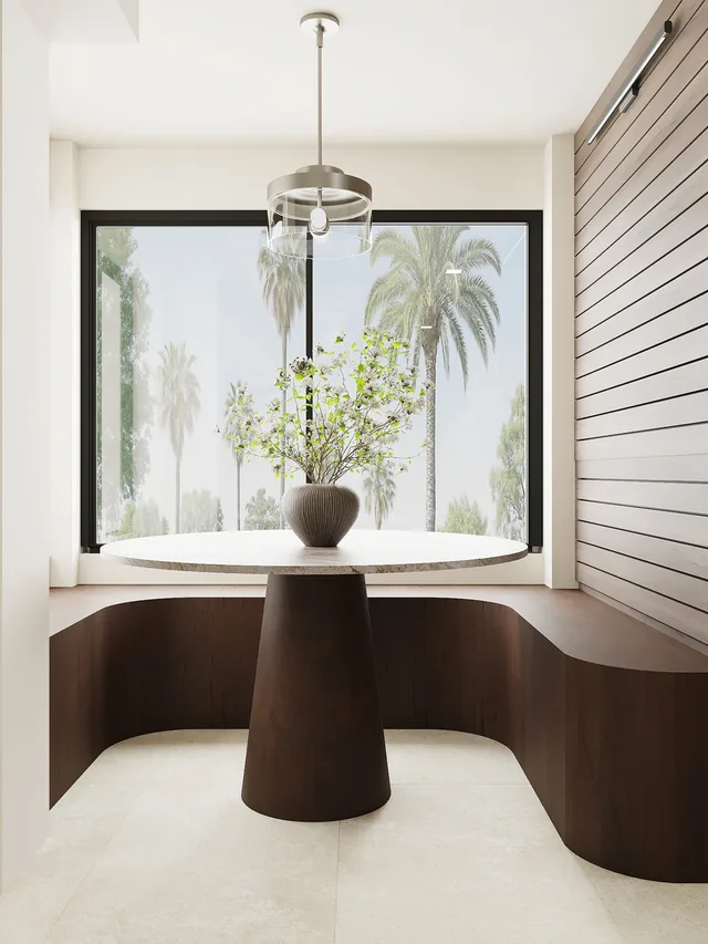 3D design of a breakfast nook with a curved dark wood banquette, a round pedestal table, a glass drum pendant, a wood slat wall and a large window