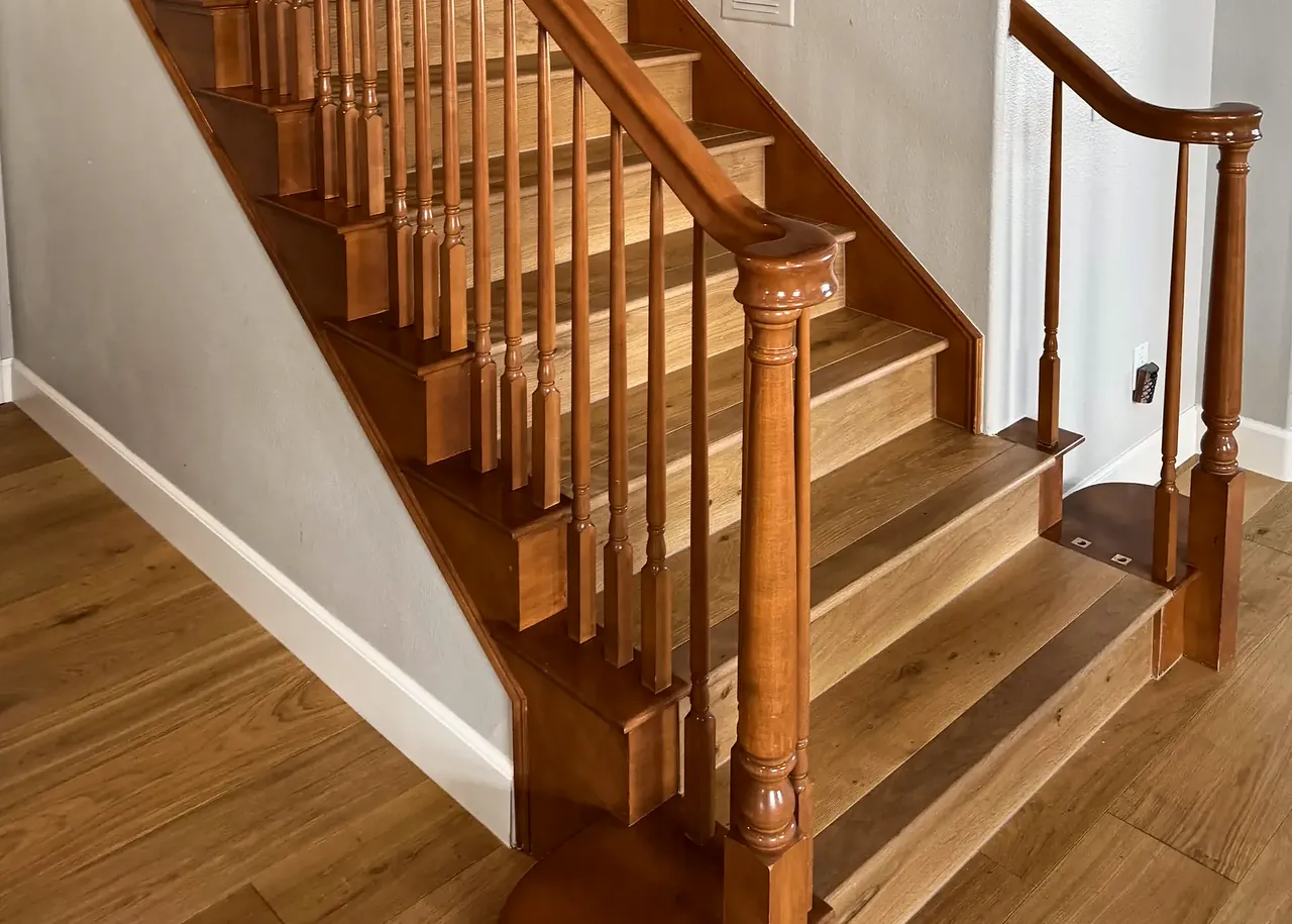 The banister before, in stained wood