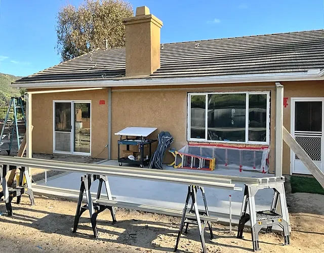 The back of the house with the patio slab, as the first sunroom posts went up