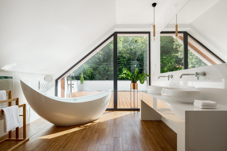 Elegant attic bathroom with bathtub